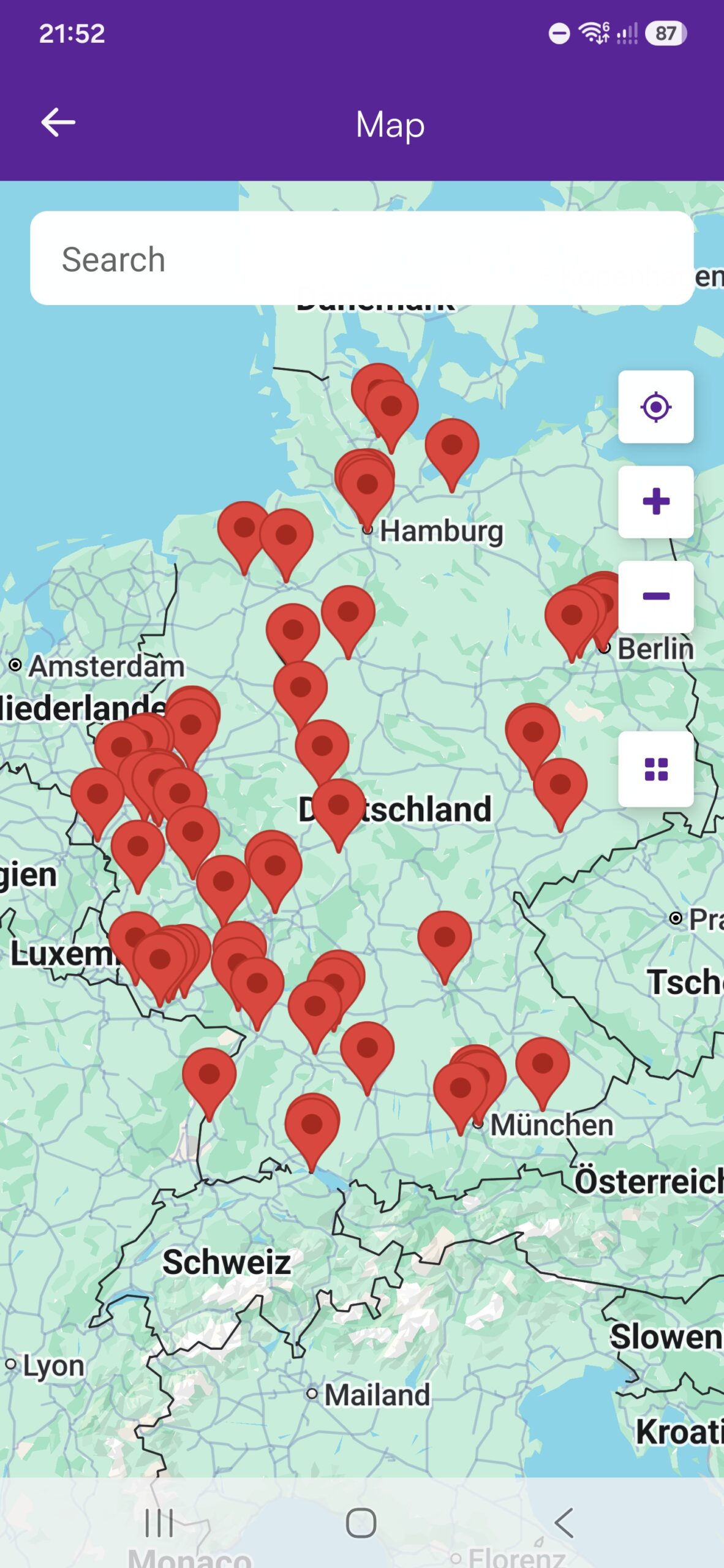 Mobile app interactive map view showing event venue location pins across Germany